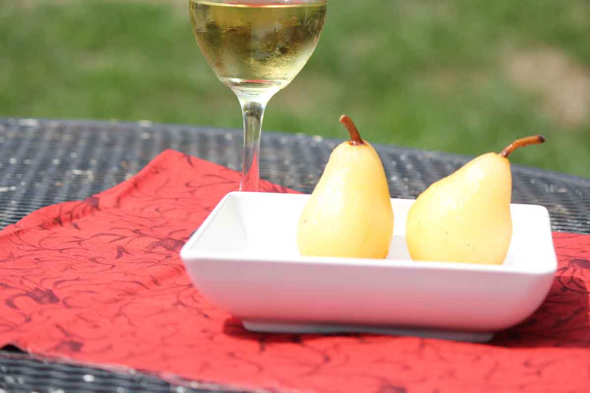 an elegant dessert of cinnamon poached pears with wine