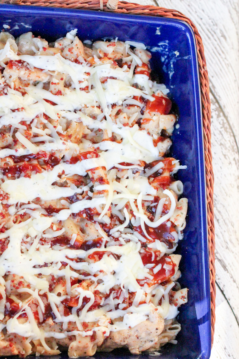 Side of a casserole dish filled with chicken ranch and bbq