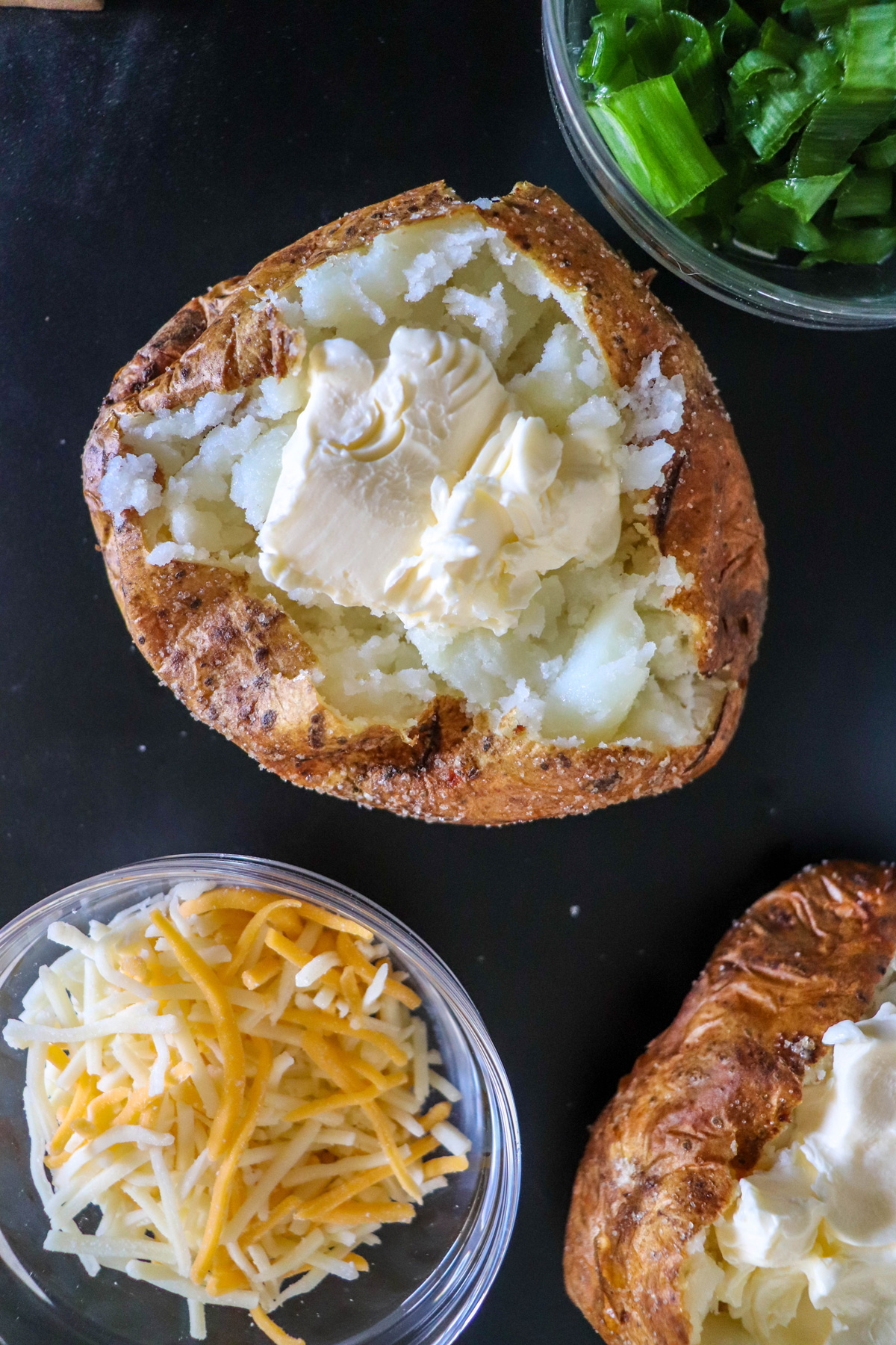 Air Fryer Baked Potatoes with Butter on top