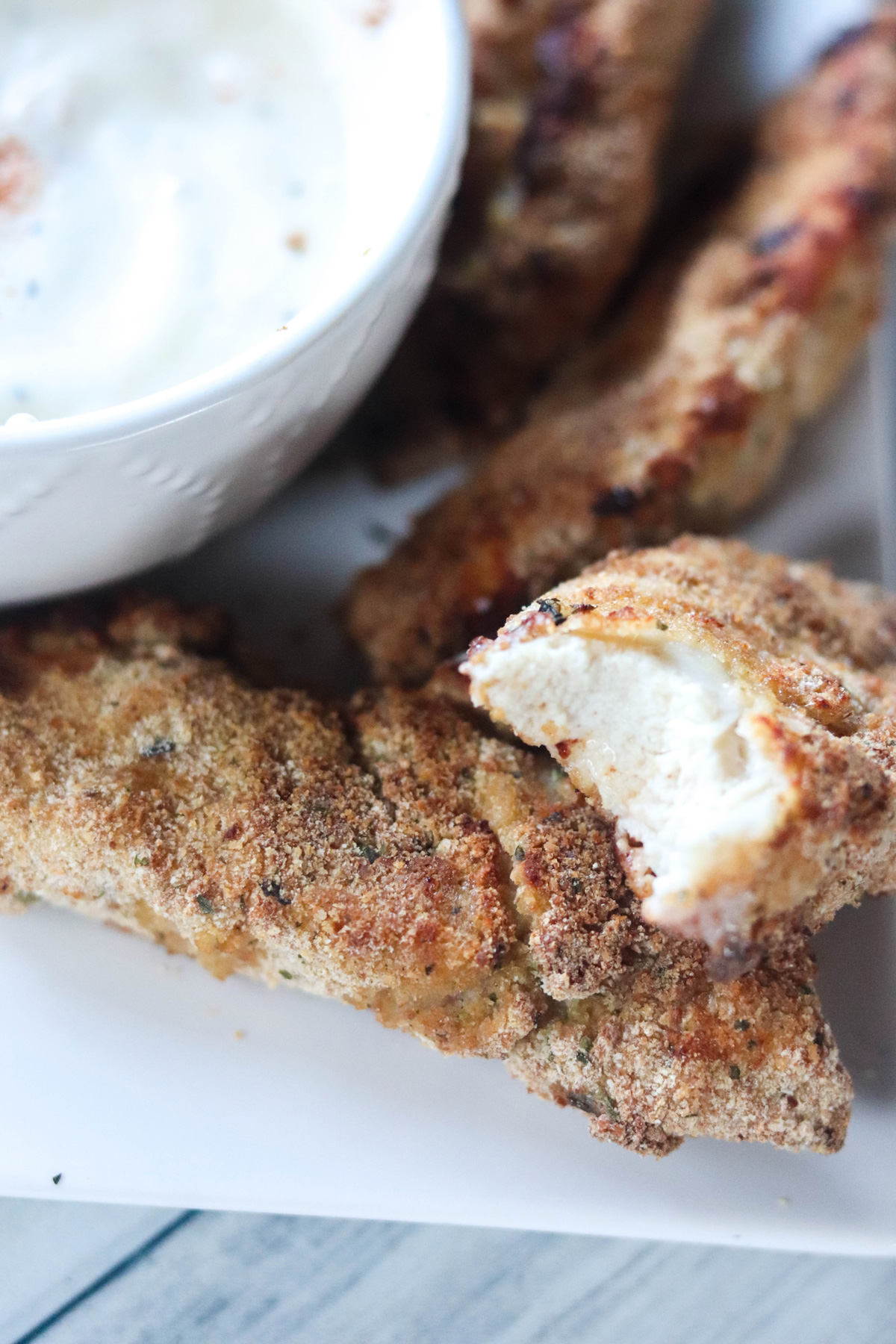 Air Fryer Chicken Fingers Close up with a bite taken out