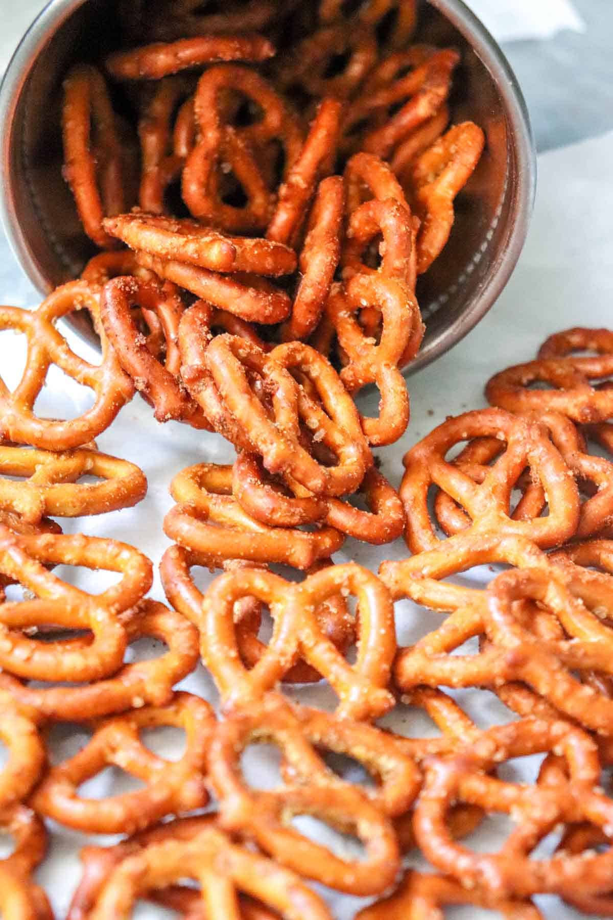 Close up of garlic onion pretzels spilled on a marble surface